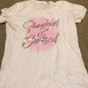 White shirt with words “thankful & blessed”